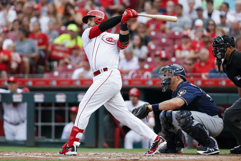 Cincinnati Reds' Eugenio Suarez watches his RBI double off Milwaukee Brewers starting pitcher Junior Guerra during the first inning of a baseball game Thursday, June 28, 2018, in Cincinnati. (AP Photo/John Minchillo)