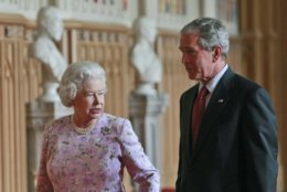 Britain's Queen Elizabeth II , left, walks with U.S. President George W. Bush, right, as they tour St. George's Hall at Windsor Castle in Windsor, England, Sunday, June 15, 2008. (AP Photo/Pablo Martinez Monsivais)