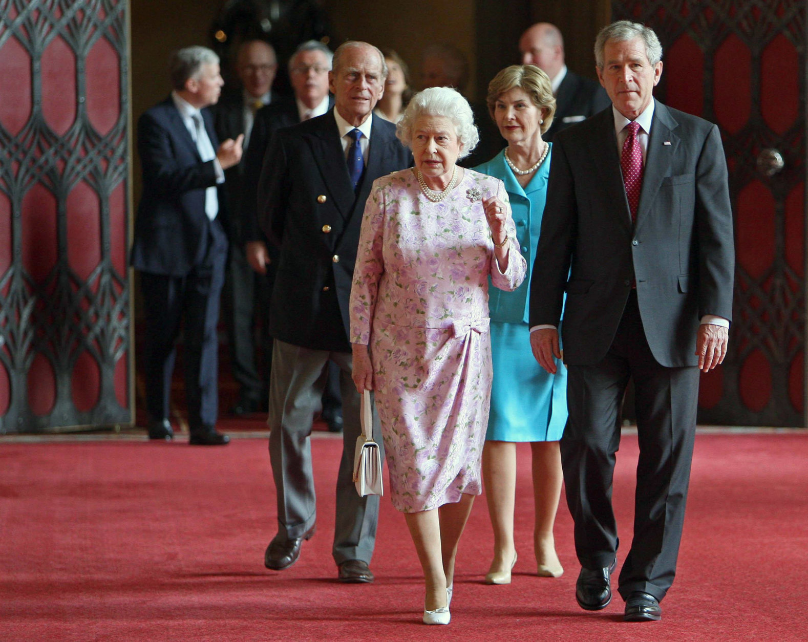Britain's Queen Elizabeth II and the Duke of Edinburgh, left, with US President George Bush and his wife Laura, behind,   in St George's Hall, Windsor Castle Sunday June 15, 2008. Heading into two days of talks, U.S. President George W. Bush and British Prime Minister Gordon Brown plan to swap strategies on how to reduce their military forces in Iraq and halt Iran's nuclear ambitions. The two leaders will also discuss Middle East peace, climate change, trade and Northern Ireland governance, Bush's national security adviser Stephen Hadley told reporters traveling with the president on Sunday. (AP Photo / Dominic Liplinski, Pool)