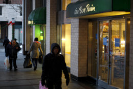 Pedestrians pass the Au Bon Pain shop in the Brooklyn borough of New York on Tuesday Dec. 22, 2009. Two emergency medical technicians accused of refusing to help a dying pregnant woman are "inhuman" and shouldn't have taken those jobs if they weren't willing to get involved, the woman's mother said Tuesday. Eutisha Revee Rennix, 25, died at a hospital Dec. 9, shortly after collapsing in the Au Bon Pain shop in Brooklyn where she worked. Her baby was too premature to survive.  (AP Photo/David Goldman)
