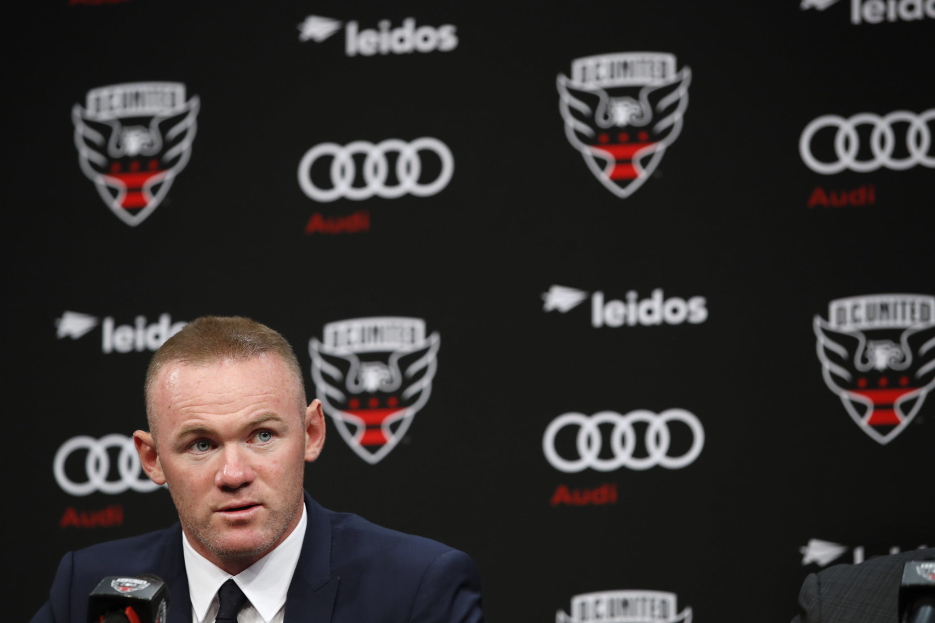 English soccer star Wayne Rooney, the all-time leading scorer for England's national team and Manchester United in the Premier League, speaks at a news conference announcing his signing with MLS team D.C. United, Monday, July 2, 2018, at the Newseum in Washington. (AP Photo/Jacquelyn Martin)