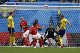 Sweden's Ola Toivonen, right, takes a shot during the round of 16 match between Switzerland and Sweden at the 2018 soccer World Cup in the St. Petersburg Stadium, in St. Petersburg, Russia, Tuesday, July 3, 2018. (AP Photo/Darko Bandic)