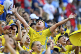 Sweden supporters celebrate after their team won the round of 16 match between Switzerland and Sweden at the 2018 soccer World Cup in the St. Petersburg Stadium, in St. Petersburg, Russia, Tuesday, July 3, 2018. (AP Photo/Martin Meissner)