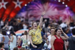 People wait for the start of rehearsals for the Boston Pops Fireworks Spectacular in Boston, Tuesday, July 3, 2018. (AP Photo/Michael Dwyer)