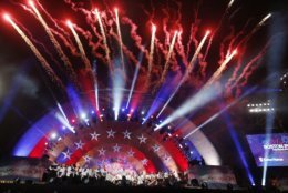 Fireworks explode over the Hatch Shell during rehearsal for the Boston Pops Fireworks Spectacular in Boston, Tuesday, July 3, 2018. (AP Photo/Michael Dwyer)