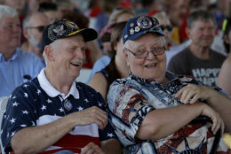 Don Wood, left, from Overland Park, Kan. and Don Ross, from Kansas City, Kan., listen to an Independence Day concert by the American Legion Band of Greater Kansas City Wednesday, July 4, 2018, in Merriam, Kan. Cleveland won 6-4. (AP Photo/Charlie Riedel)