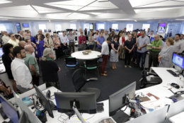 Employees gather in the newsroom of the New York headquarters of The Associated Press, Thursday, July 5, 2018, for a moment of silence for the five employees of the Capital Gazette, a Maryland newspaper, who were killed a week ago in one of the deadliest attacks on journalists in U.S. history. (AP Photo/Richard Drew)