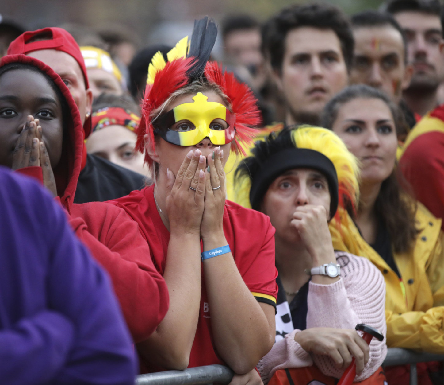 Belgium fans react as they watch a 2018 World Cup semifinal soccer match between France and Belgium on a giant screen in Jette, Belgium, Tuesday, July 10, 2018. (AP Photo/Olivier Matthys)