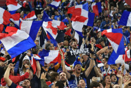 France supporter cheer after their team advanced to the final during the semifinal match between France and Belgium at the 2018 soccer World Cup in the St. Petersburg Stadium in St. Petersburg, Russia, Tuesday, July 10, 2018. (AP Photo/Martin Meissner)