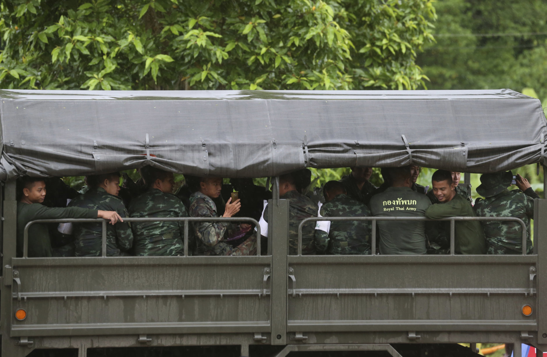 Thai soldiers leave a cave rescue area in Mae Sai, Chiang Rai province, northern Thailand, Wednesday, July 11, 2018. A daring rescue mission in the treacherous confines of a flooded cave in northern Thailand has saved all 12 boys and their soccer coach who were trapped deep within the labyrinth, ending a grueling 18-day ordeal that claimed the life of an experienced volunteer diver and riveted people around the world. (AP Photo/Sakchai Lalit)