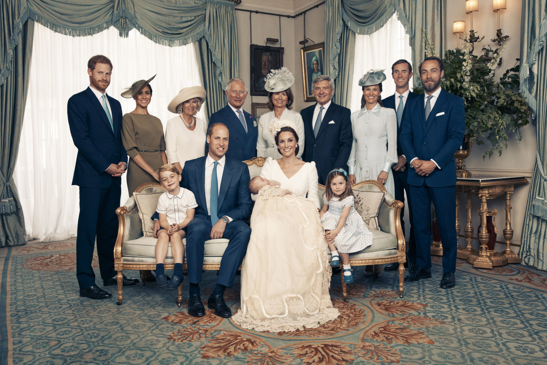 This Monday, July 9, 2018, photo provided by the Duke and Duchess of Cambridge shows the official photograph to mark the christening of Prince Louis at Clarence House, following Prince Louis' baptism, in London. Seated, left to right: Prince George, Prince William, the Duke of Cambridge; Prince Louis; Kate, the Duchess of Cambridge; and Princess Charlotte. Standing, left to right: Prince Harry, The Duke of Sussex; Megan, the Duchess of Sussex; Camilla, the Duchess of Cornwall; Prince Charles, Prince of Wales; Carole Middleton, Michael Middleton, Pippa Matthews, James Matthews and James Middleton. (Matt Holyoak/Camera Press/Duke and Duchess of Cambridge via AP)