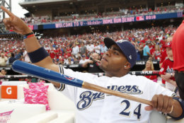 Milwaukee Brewers Jesús Aguilar (24) points toward the outfield before the MLB Home Run Derby, at Nationals Park, Monday, July 16, 2018 in Washington. The 89th MLB baseball All-Star Game will be played Tuesday. (AP Photo/Alex Brandon)