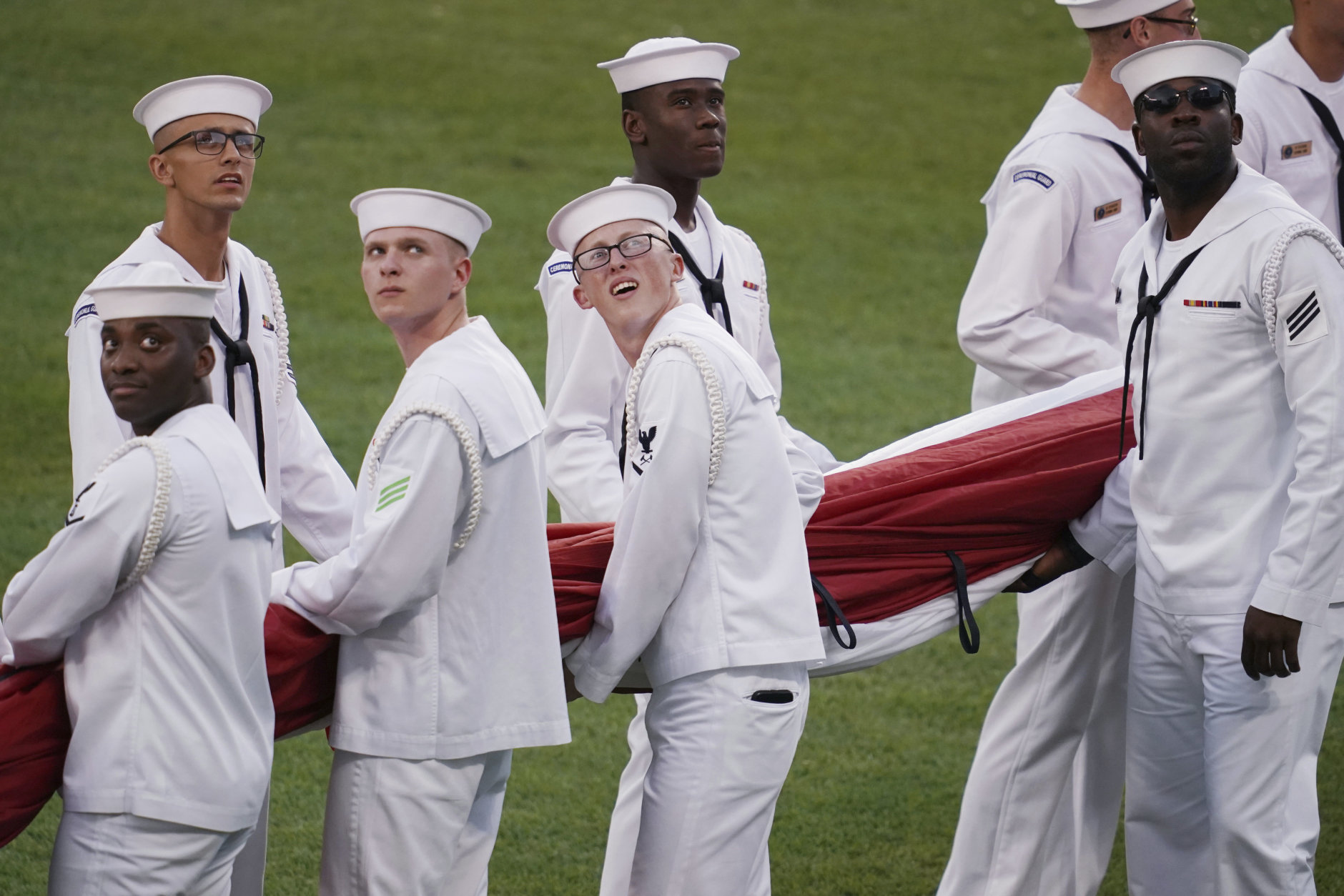 U.S. Navy sailors unfurl a flag before the MLB Home Run Derby, at Nationals Park, Monday, July 16, 2018 in Washington. The 89th MLB baseball All-Star Game will be played Tuesday. (AP Photo/Carolyn Kaster)