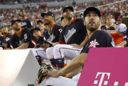 American League, Boston Red Sox pitcher Justin Verlander, right, watches play during the MLB Home Run Derby, at Nationals Park, Monday, July 16, 2018 in Washington. The 89th MLB baseball All-Star Game will be played Tuesday. (AP Photo/Patrick Semansky)