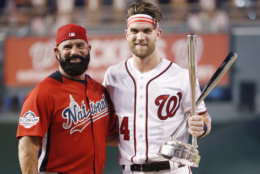 Washington Nationals Bryce Harper stands with his father Ron Harper after Bryce won the Major League Baseball Home Run Derby, Monday, July 16, 2018 in Washington. The 89th MLB baseball All-Star Game will be played Tuesday. (AP Photo/Alex Brandon)