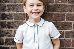 In this photo taken on Monday, July 9, 2018, Britain's Prince George poses for a picture following the christening of his brother Prince Louis, at Clarence House in London. Britain's Prince William and Kate, Duchess of Cambridge have released a photo of Prince George to mark his fifth birthday on Sunday, July 22. (Matt Porteous via AP)