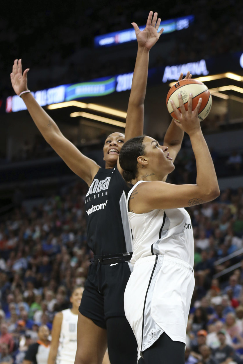 Team Candace Parker's Liz Cambage, right, shoots the ball against Team Delle Donne's A'ja Wilson, left, in the first half of the WNBA All-Star basketball game Saturday, July 28, 2018 in Minneapolis. (AP Photo/Stacy Bengs)