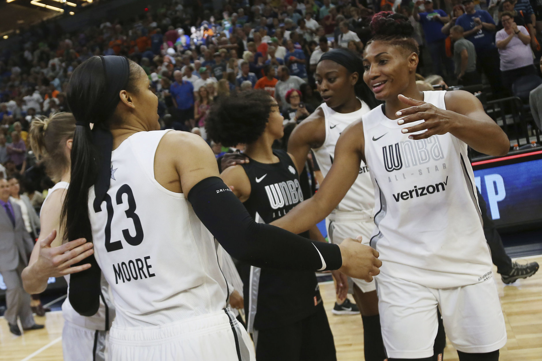 Team Candace Parker's Maya Moore, left, and Angel McCoughtry, right, celebrate after their team won 119-112 against Team Delle Donne in the WNBA All-Star basketball game Saturday, July 28, 2018 in Minneapolis. (AP Photo/Stacy Bengs)