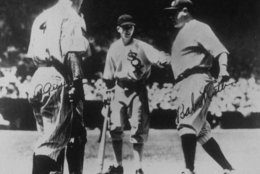 Babe Ruth crosses home plate following a two run home run off National League starting pitcher Bill Hallahan in the third inning of the first All-Star Game ever played, July 6, 1933.  Greeting Ruth at home plate are, from left:  Yankee teammate, Lou Gehrig and White Sox bat boy, John McBride.  Barely visible behind Gehrig is National League catcher Jimmie Wilson.  The American League won 4-2. (AP Photo)