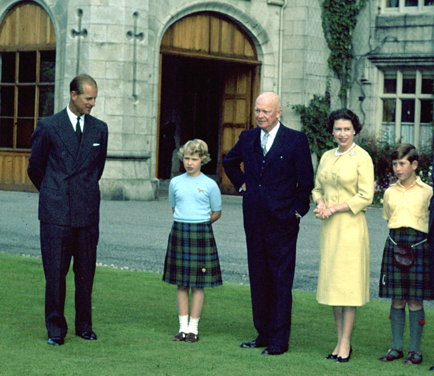 Britain's Queen Elizabeth II stands in the grounds of Balmoral Castle, Scotland, with U.S. President Eisenhower, Aug. 29, 1959. From left to right, Prince Philip, Princess Anne, President Eisenhower, Queen Elizabeth II and Prince Charles. (AP Photo).