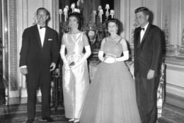 Britain's Queen Elizabeth II poses with U.S. President John F. Kennedy, before a state dinner at Buckingham Palace, June 5, 1961. Also seen are the Duke of Edinburgh, left, and President Kennedy's wife Jackie, second left. (AP Photo/Pool)