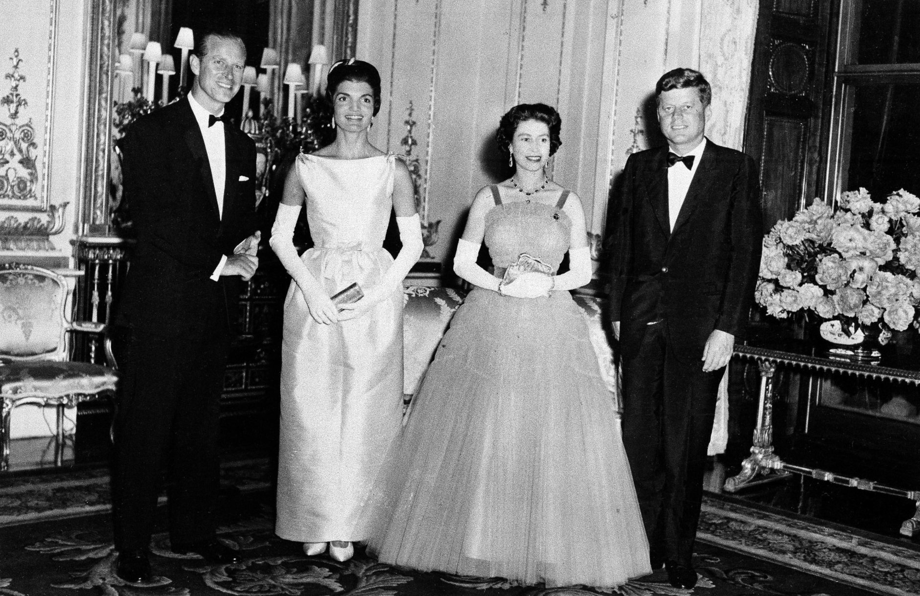 Queen Elizabeth II poses with President John Kennedy, first lady Jacqueline Kennedy, and Prince Philip, June 5, 1961, at Buckingham Palace in London.  The Kennedys were guests of the Queen at dinner.  (AP Photo)