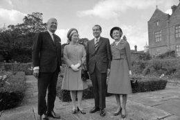 Queen Elizabeth II and British Prime Minister Edward Heath stand with United States President Richard Nixon and Mrs. Nixon, right, on the terrace at Chequers, United Kingdom, the Prime Minister's official country residence on Oct. 3, 1970, before lunching there. The Nixon's were on a flying visit to England as part of the President's European tour. (AP Photo/Henry Burroughs)
