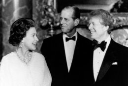 President Jimmy Carter, right, poses with Queen Elizabeth II and Prince Philip, May 7, 1977, at Buckingham Palace prior to the State Dinner for Carter and six other heads of state. (AP Photo/OBPA)
