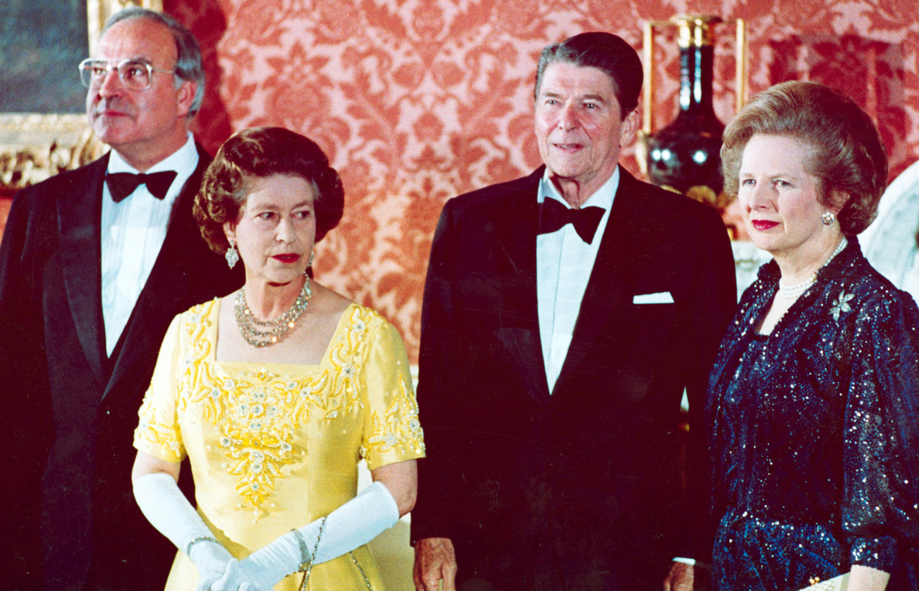Britain's Queen Elizabeth II, second left, stands with, West German Chancellor Helmut Kohl, left, U.S. President Ronald Reagan, second right, and Britain's Prime Minister Margaret Thatcher at London's Buckingham Palace, prior to a dinner for summit leaders, June 10, 1984.  (AP Photo)