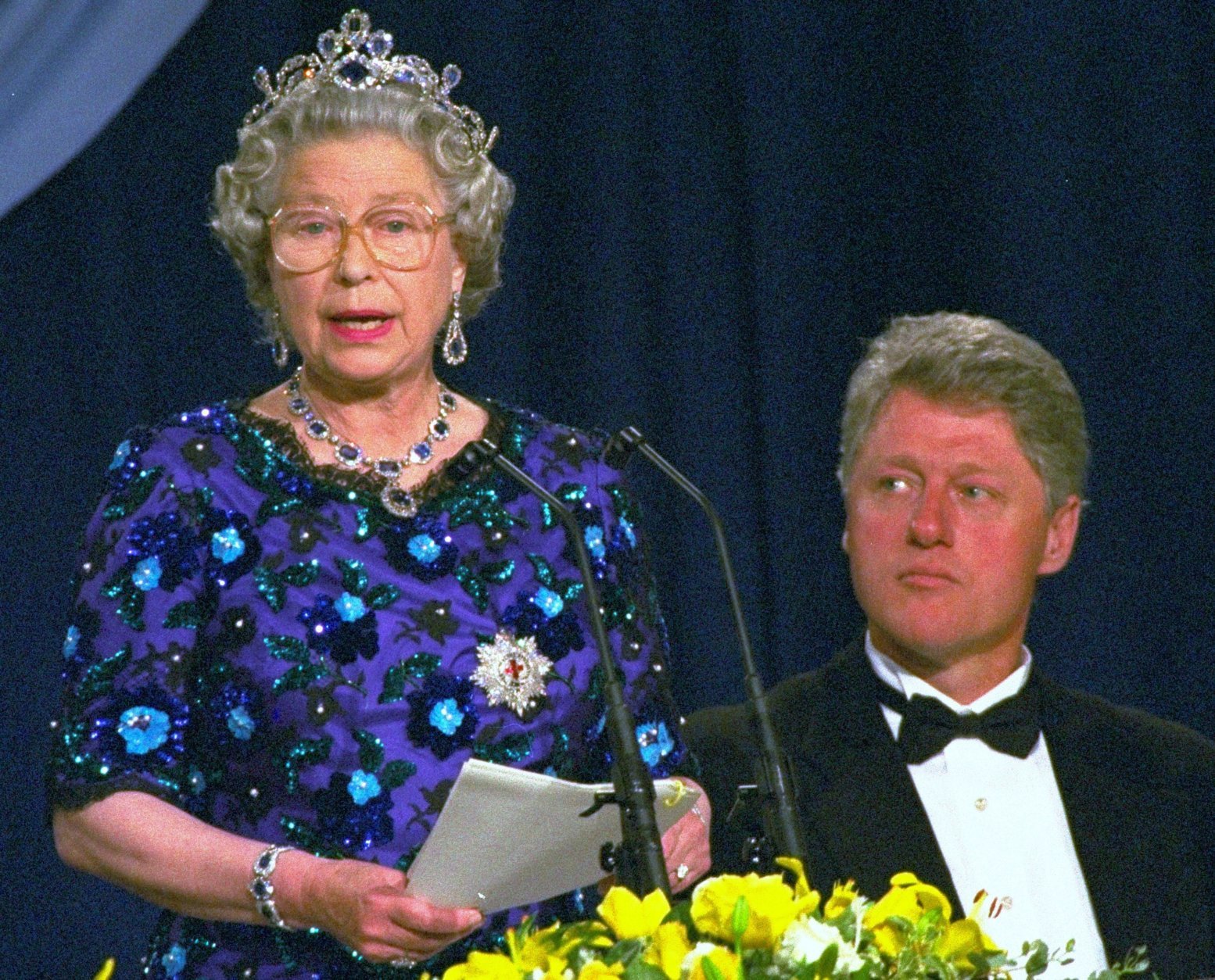 President Bill Clinton listens as Britain's Queen Elizabeth II speaks, during a dinner at the Guildhall in Portsmouth Saturday June, 4, 1994, to commemorate the 50th anniversary of the D-Day landings in Normandy.  (AP Photo/Doug Mills)