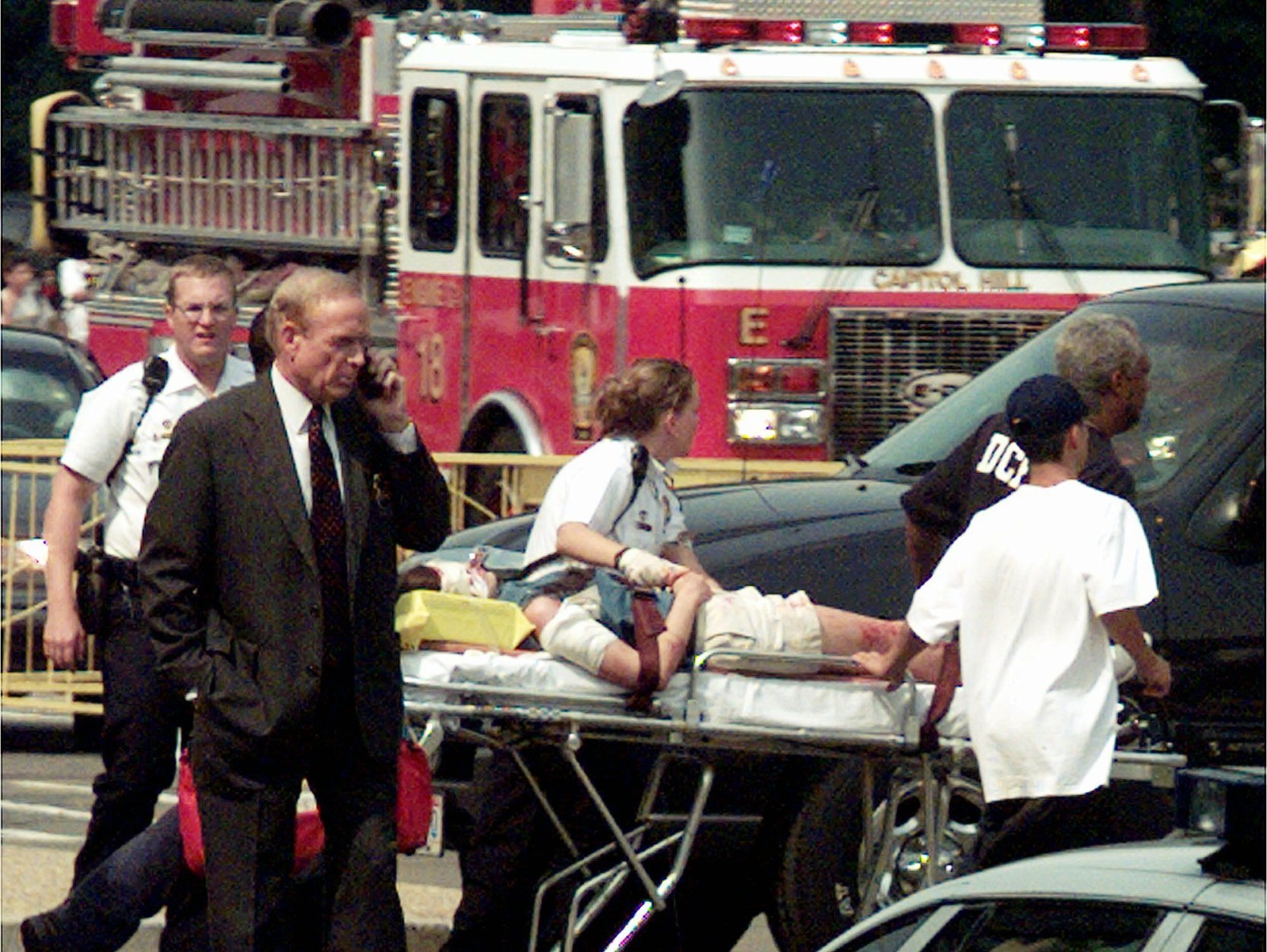 An unidentified victim is rushed to a helicopter on Capitol Hill Friday, July 24, 1998  in Washington. Two policemen, a female tourist and a suspected gunman were wounded late Friday afternoon in an exchange of gunfire inside the Capitol at the office of Rep. Tom DeLay, R-Texas, officials said.  The shootings on the first floor of the Capitol building occurred about 3:40 p.m. EDT, with the House in session and the Senate just finished for the day. The historic white-domed building was filled with tourists. (AP Photo/Joe Marquette)