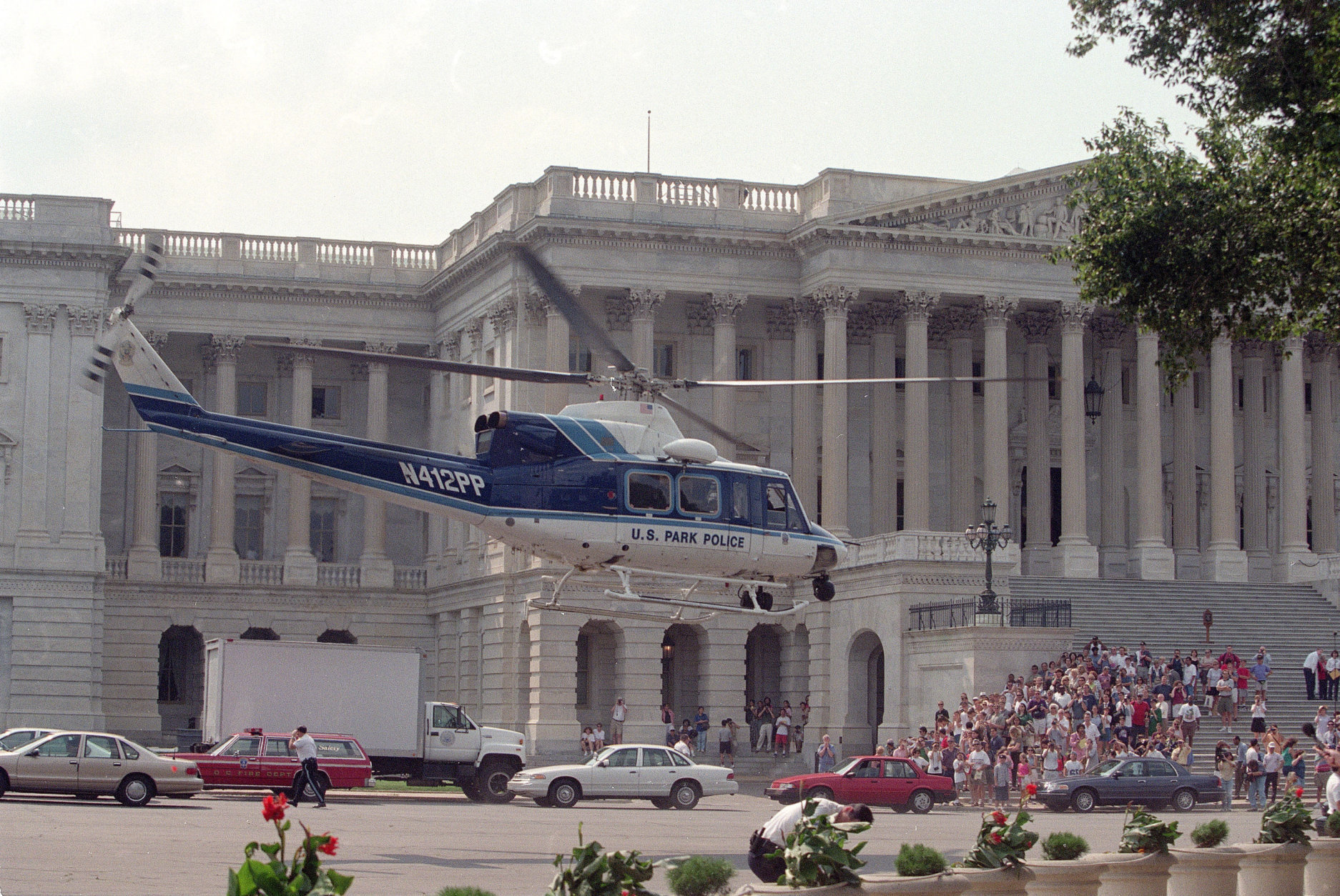A U.S. Park Police helicopter lifts off from the grounds of the Capitol in Washington, D.C. on Friday, July 24, 1998.  Two policemen, a female tourist and a suspected gunman were wounded in an exchange of gunfire after a gunman opened fire inside the Capitol building.  (AP Photo/Khue Bui)