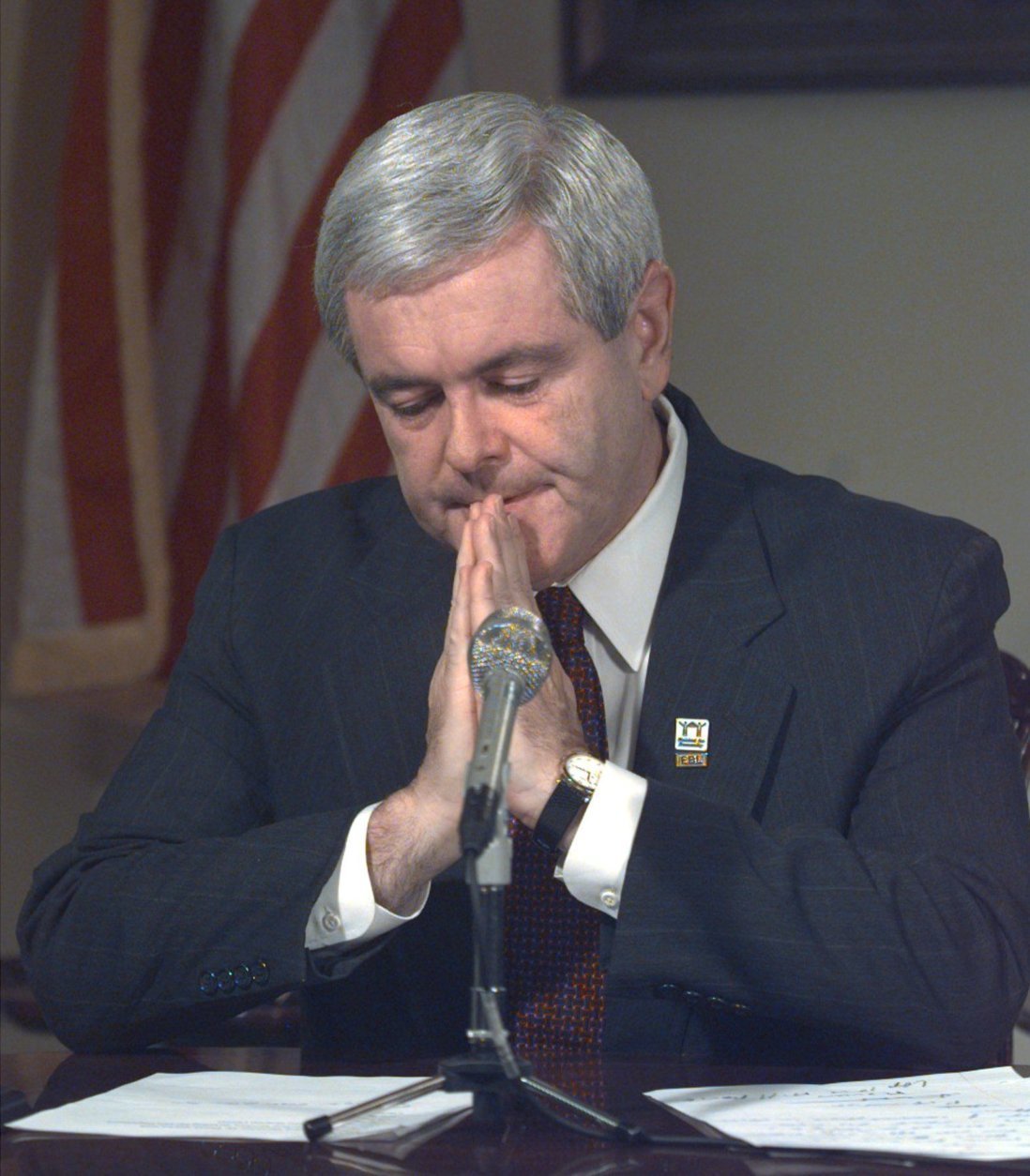 House Speaker Newt Gingrich speaks during a weekly GOP radio address in his Capitol office Saturday, July 25, 1998, in Washington.  With a tear running down his right cheek, Gingrich bowed his head in prayer. "Please help this country learn to live with its freedom," he said.  Investigators are trying to learn how and why the gunman stormed the Capitol building filled with lawmakers and tourists, and opened fire before being shot and captured. A tourist was wounded in the fire fight. (AP Photo/Harry Hamburg, Pool)