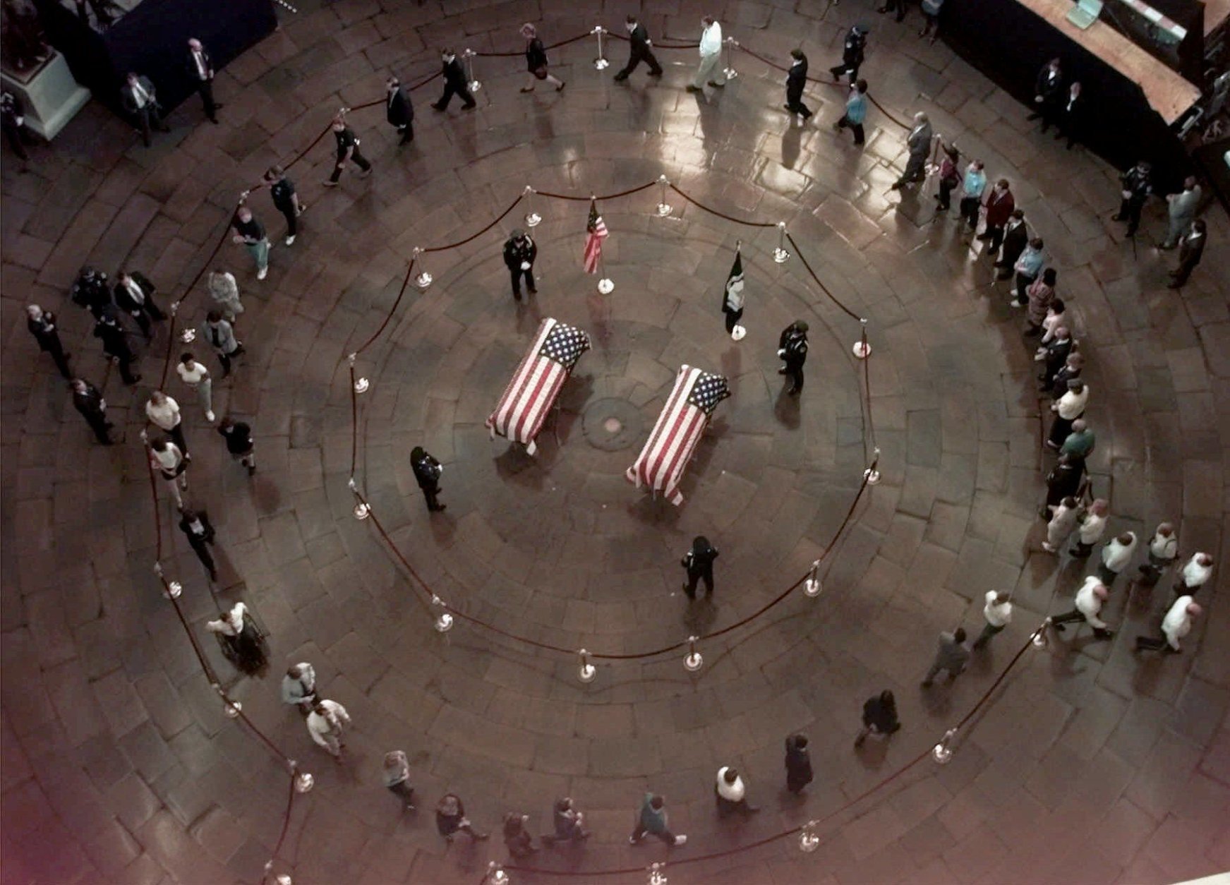 The coffins of officers Jacob J. Chesnut and John Gibson lie in honor at the Capitol Rotunda Tuesday morning, July 28, 1998, in Washington. (AP Photo/Joe Marquette, Pool)