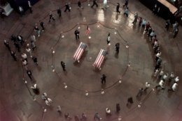 The coffins of officers Jacob J. Chesnut and John Gibson lie in honor at the Capitol Rotunda Tuesday morning, July 28, 1998, in Washington. (AP Photo/Joe Marquette, Pool)