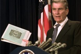 Senate Rules Committee Chairman Sen. John Warner, R-Va. holds the classified Senate Oversight Security plan during a Capitol Hill news conference Wednesday July 29, 1998 to discuss Capitol Security measures. Warner's committee oversees activities on the Capitol grounds. Republican leaders would like to push legislation through Congress this year for a new Capitol visitors center, after two fallen police officers who died protecting the building. (AP Photo/Joe Marquette)