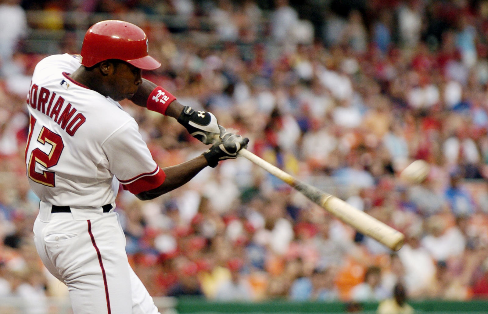 Washington Nationals' Alfonso Soriano hits a solo home run against the San Diego Padres during the first inning of a baseball game Saturday, July 8, 2006 in Washington.(AP Photo/Nick Wass)