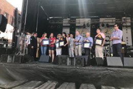 Family members of the Capital Gazette shooting victims received flags flown over the State House in honor of their loved ones. (WTOP/Dick Uliano)