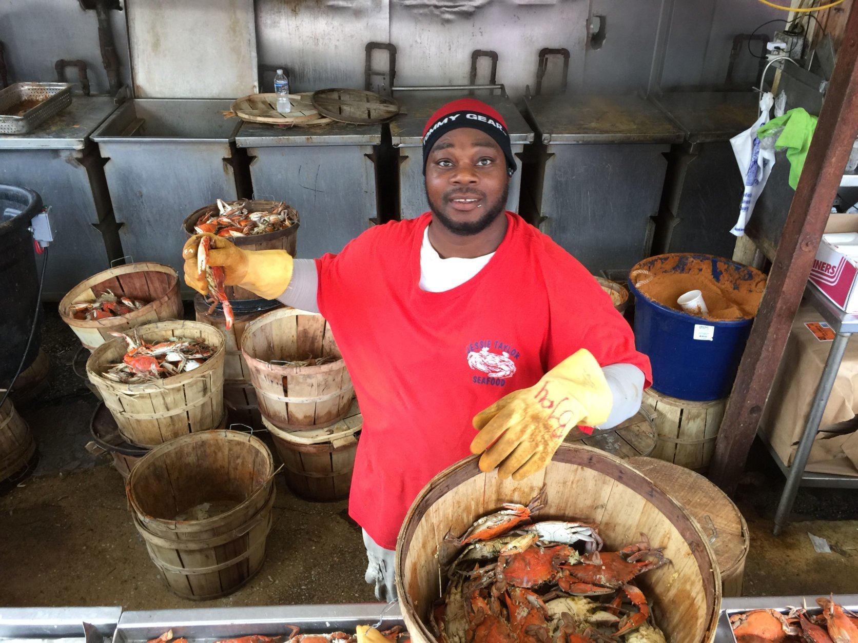 Working the seafood steamers in already-hot weather, B.J. Rogers of Chesapeake Va. said, "You just work hard and keep at it." (WTOP/Kristi King)