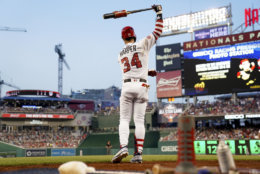 Washington Nationals' Bryce Harper warms up during a baseball game against the Boston Red Sox at Nationals Park, Monday, July 2, 2018, in Washington. (AP Photo/Andrew Harnik)