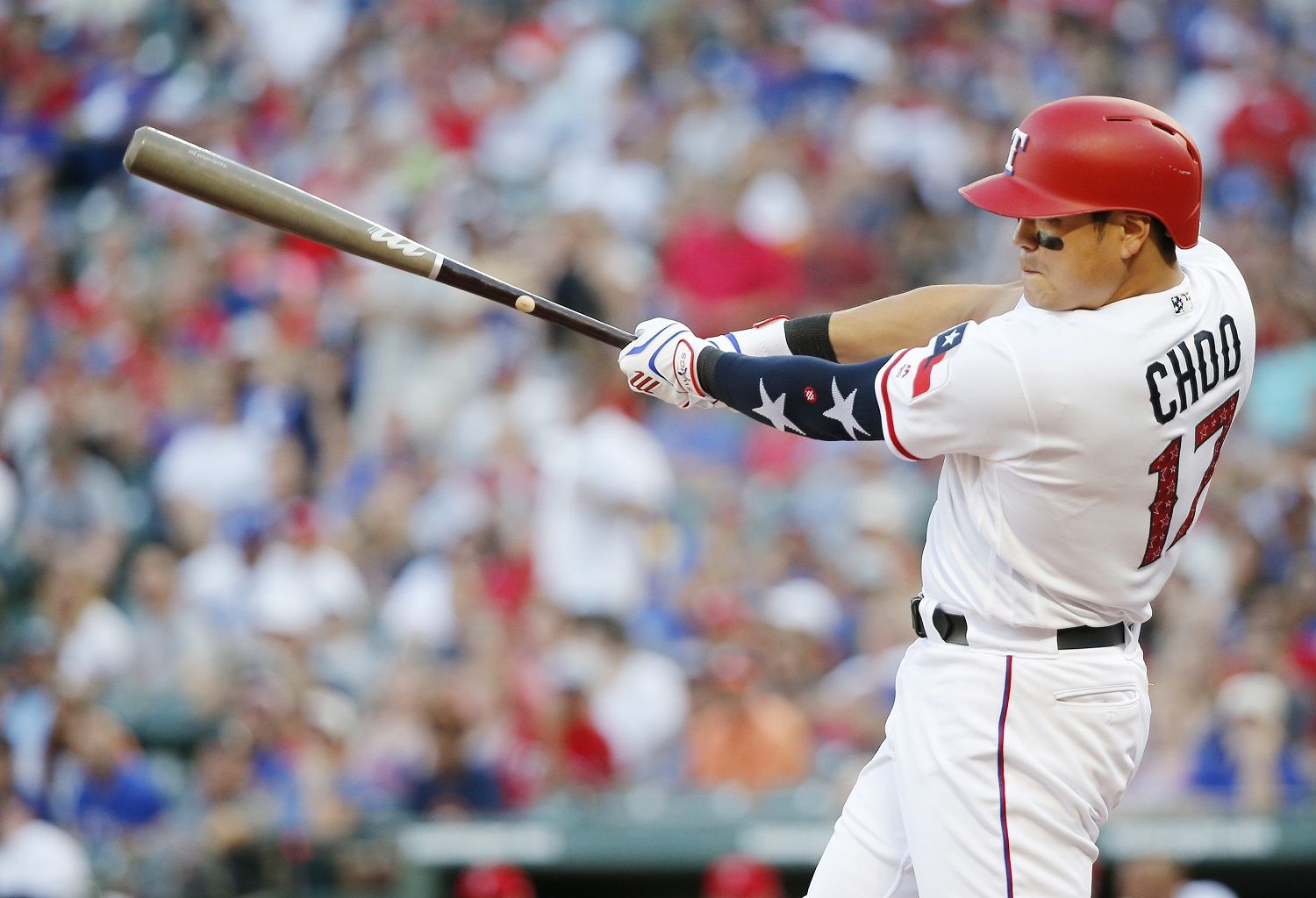 Texas Rangers' Shin-Soo Choo swings for a single during the fourth inning of the team's baseball game against the Houston Astros, Wednesday, July 4, 2018, in Arlington, Texas. Houston won 5-4 in t10 innings. (AP Photo/Brandon Wade)