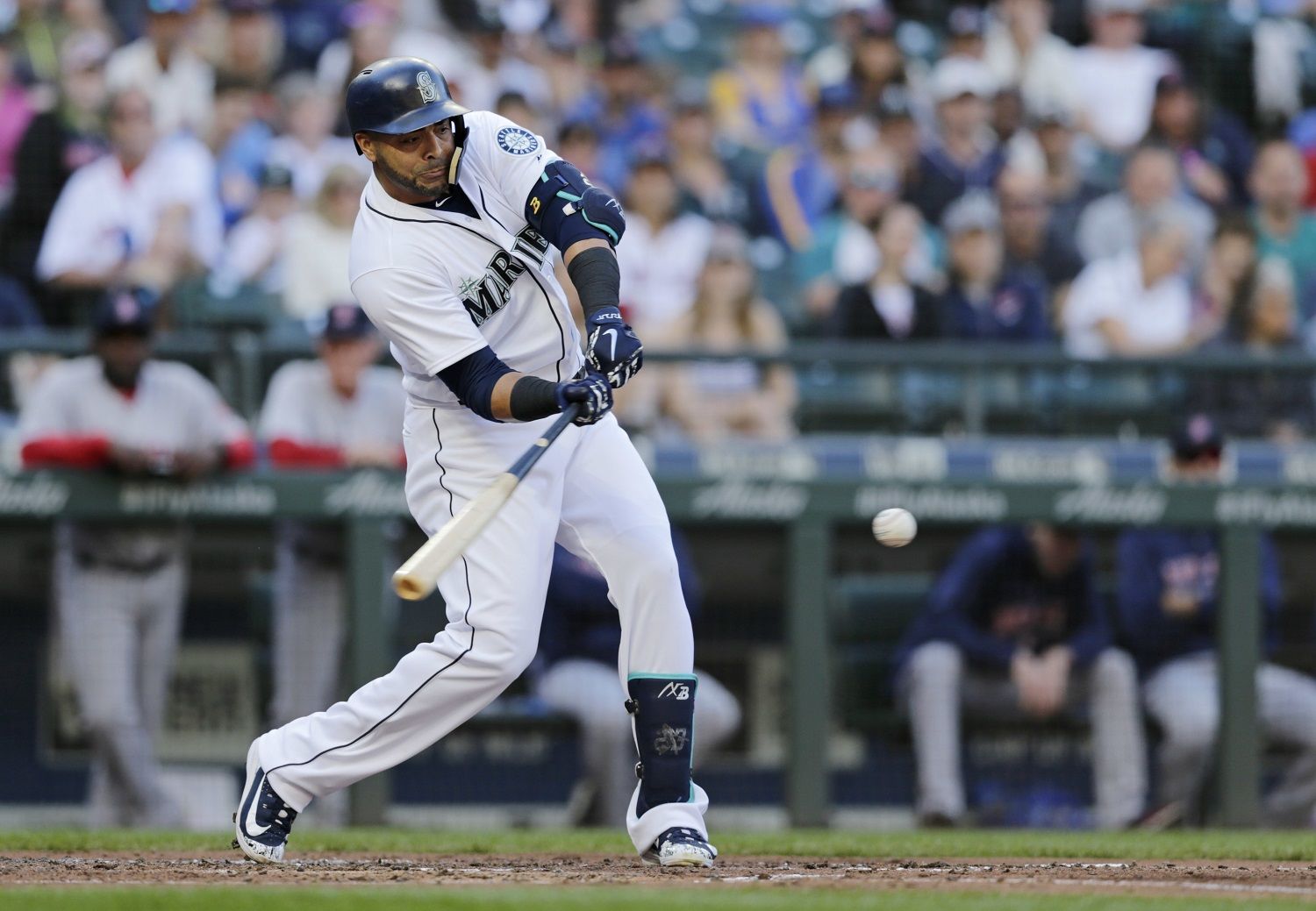 Seattle Mariners' Nelson Cruz hits an RBI single against the Boston Red Sox during the third inning of a baseball game Saturday, June 16, 2018, in Seattle. (AP Photo/John Froschauer)