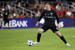 D.C. United forward Wayne Rooney (9) works with the ball during the second half of an MLS soccer match against the Vancouver Whitecaps, at Audi Field, Saturday, July 14, 2018, in Washington. DC United won 3-1. (AP Photo/Alex Brandon)