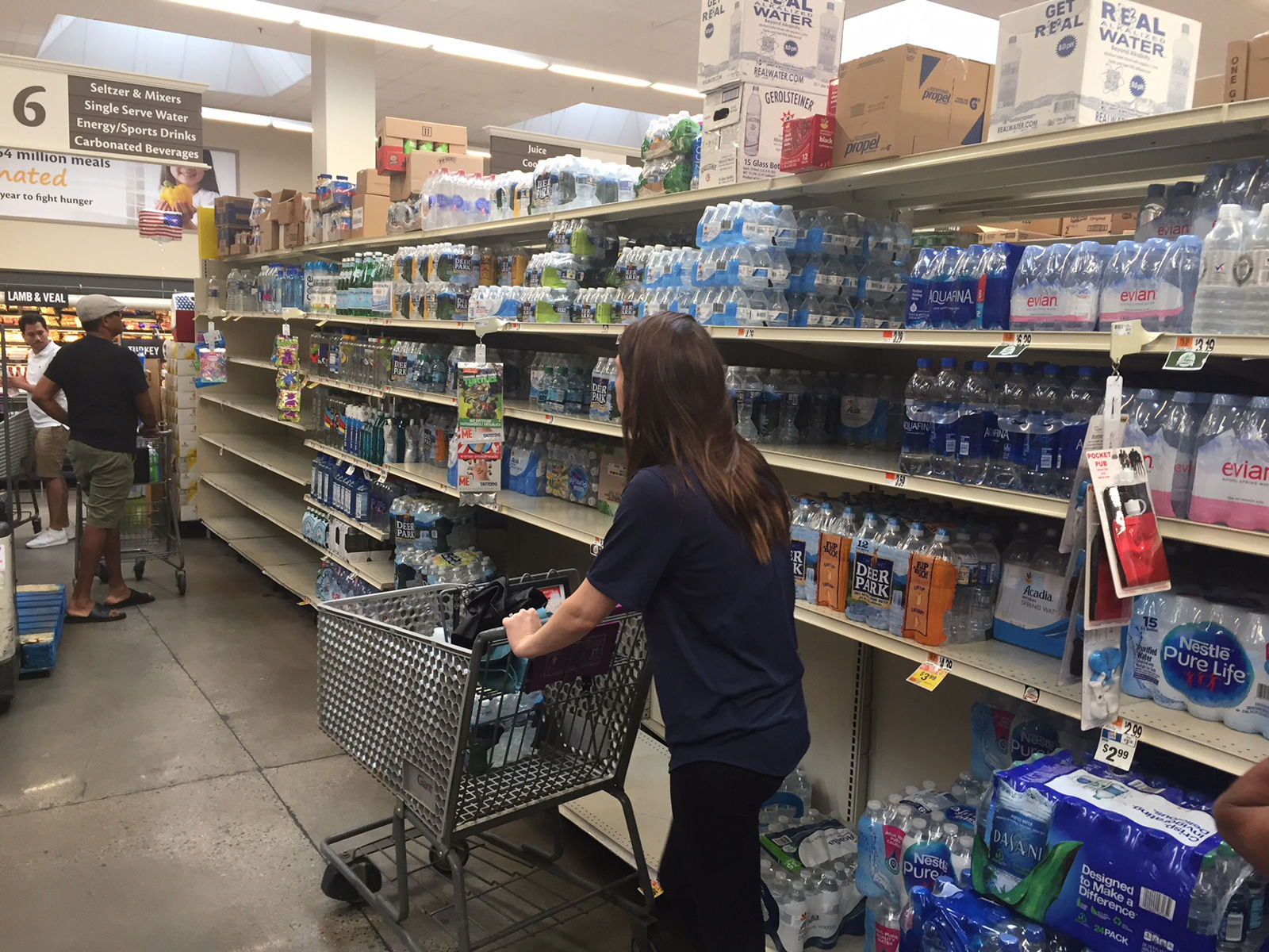 Water was flying off the shelves faster than it could be restocked in the wake of the water boil advisory, but many of the people buying water said they were doing so out of an ambundance of caution. (WTOP/John Domen)