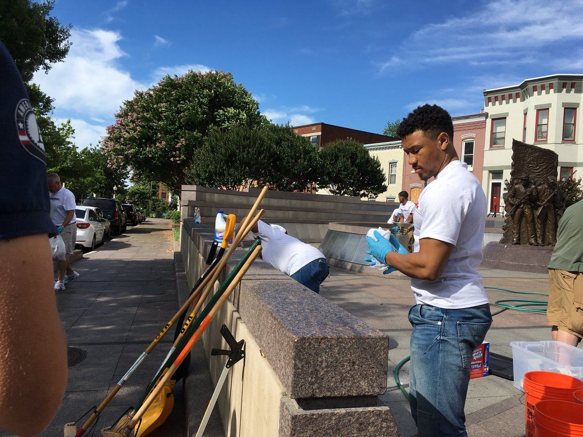 Volunteers got together on Saturday to clean the African American Civil War Memorial. (WTOP/Liz Anderson)