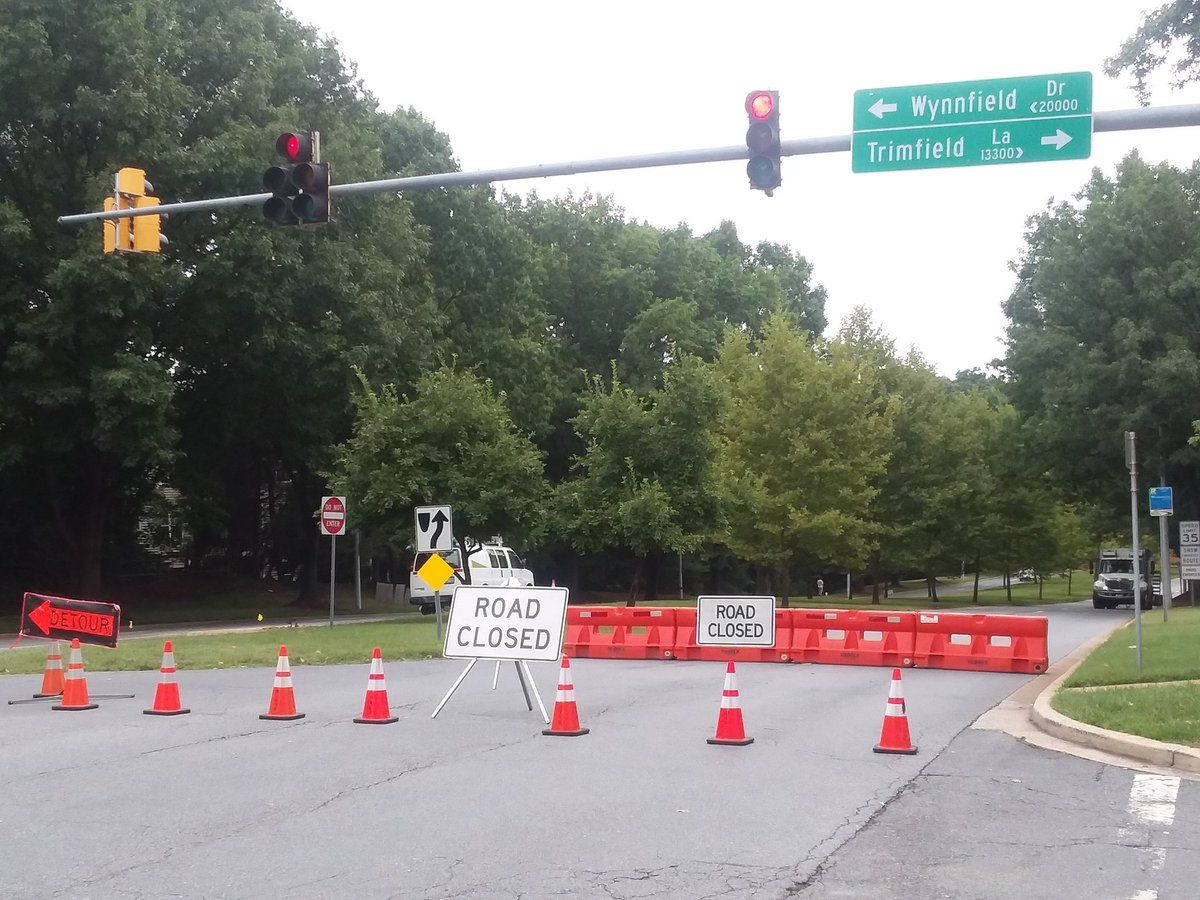A sinkhole has caused headaches for drivers and repair workers alike in Germantown, Maryland, on Sunday, and some workers on the field say it may take weeks to fix the source of the problem. (WTOP/Ralph Fox) 