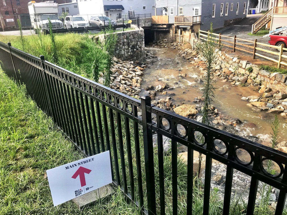 The downtown shopping district has a canal below some businesses and homes. After two major floods in two years, the past days of heavy rain have been unsettling for some residents and business owners. (WTOP/Neal Augenstein)  