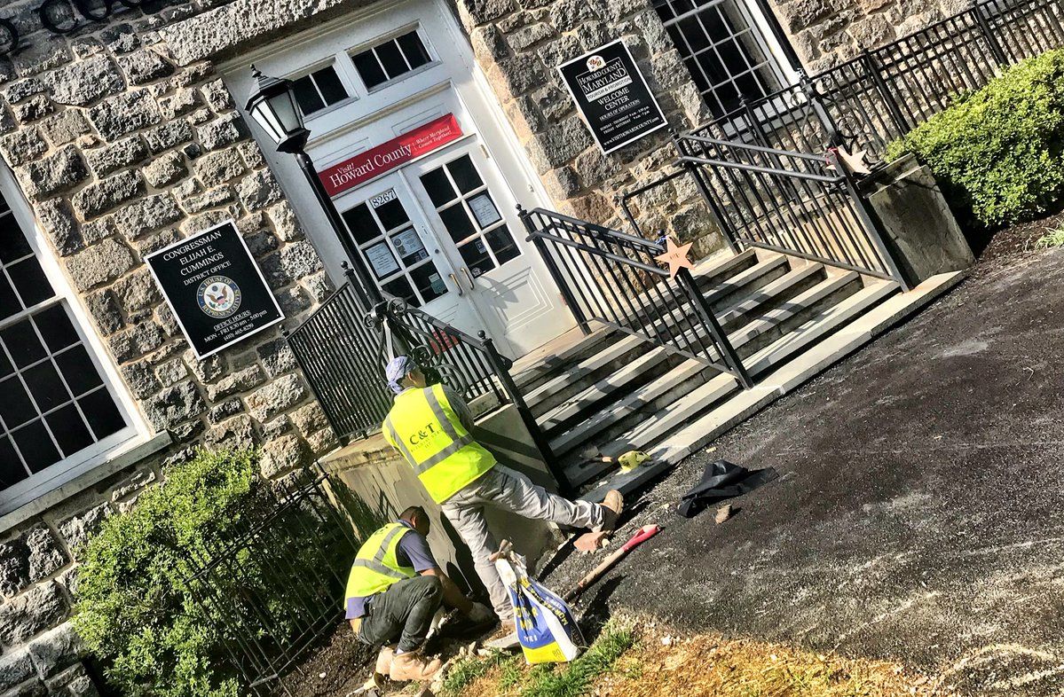Crews are working to restore the entrance to the Howard County Welcome Center on Ellicott City's Main Street. (WTOP/Neal Augenstein) 