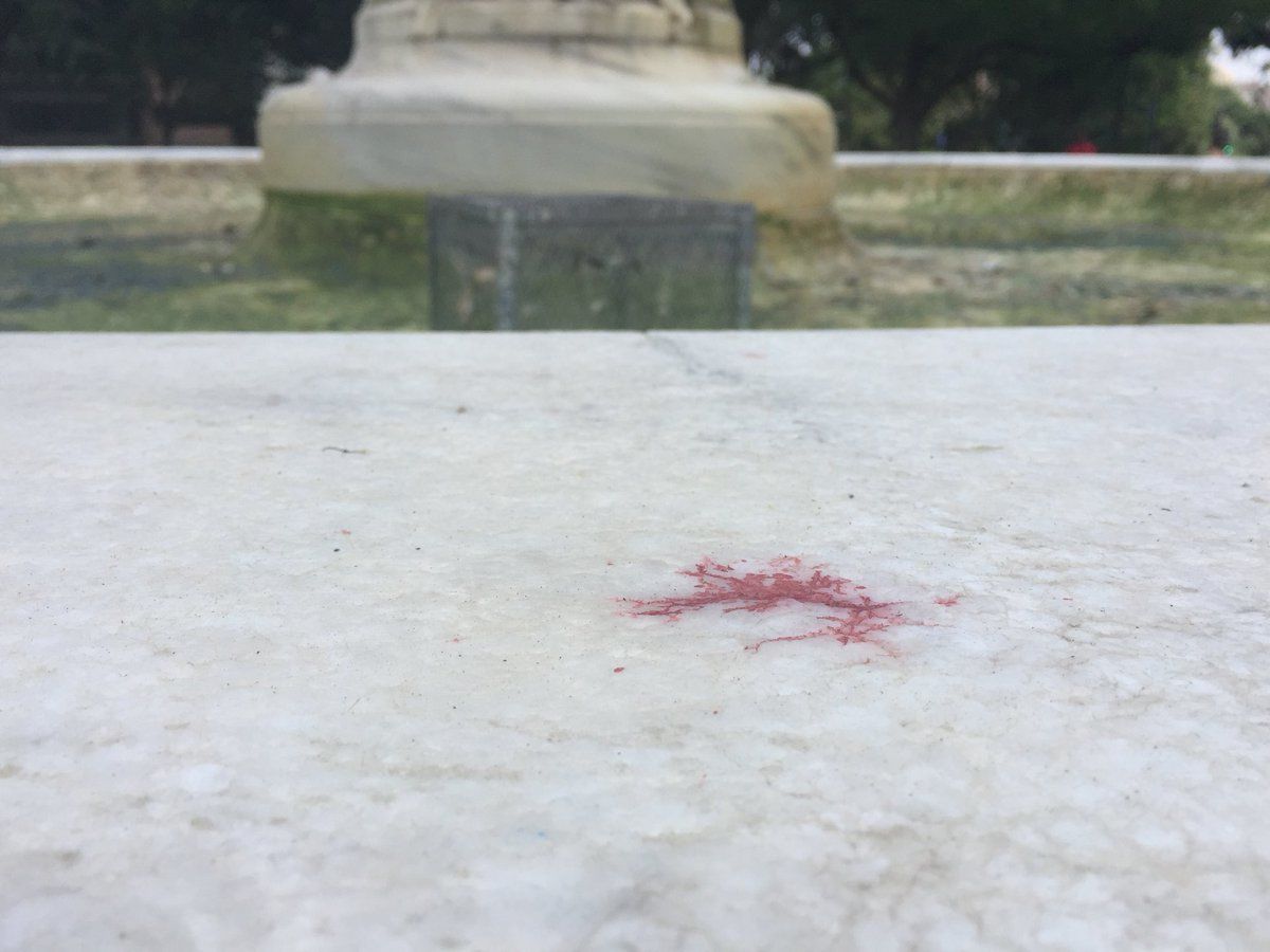 The National Park Service drained the Dupont Circle Fountain after someone dyed the water red. (WTOP/Kristi King)