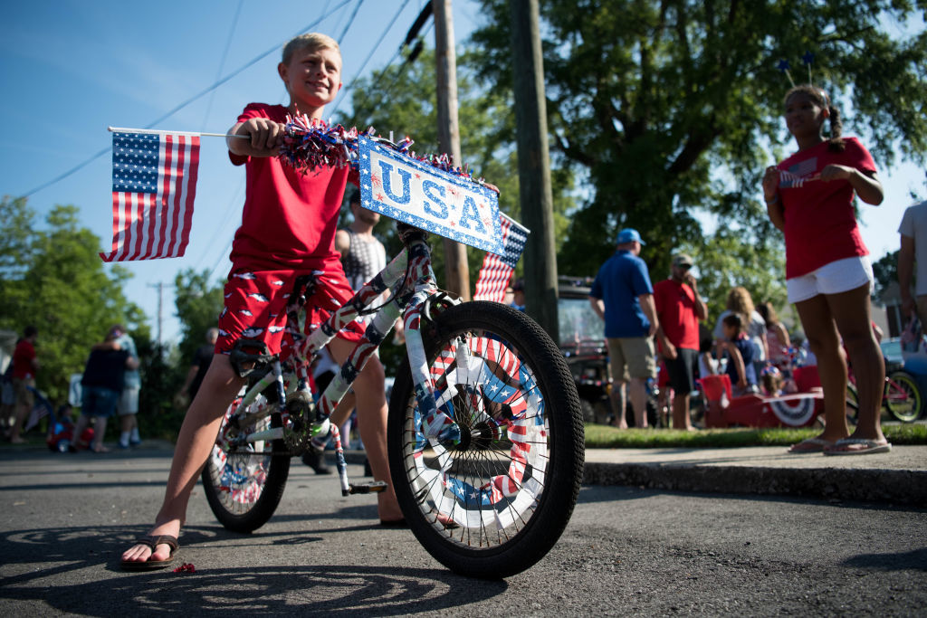 NEWBERRY, SC - JULY 04: Nine-year-old Wyatt Stuhr waits for the start of the sixteenth annual Harper Street Parade on July 4, 2018 in Newberry, South Carolina. The event, beginning as a small bicycle gathering with less than thirty children, attracted 4,000 people last year. (Photo by Sean Rayford/Getty Images)